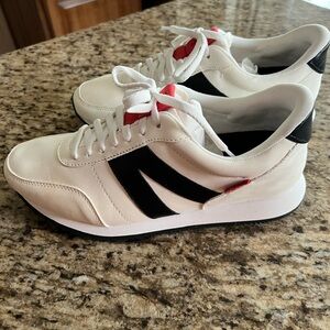 Kizik optic leather tennis shoes.